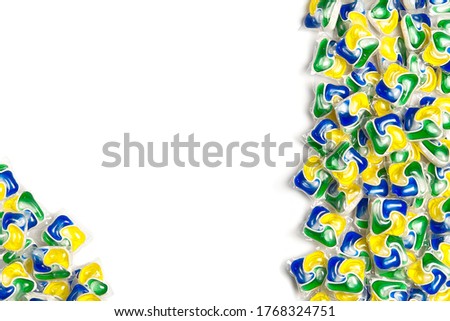 Dishwashers capsules, background of all-in-one capsules with laundry detergent and dishwasher soap. copy space