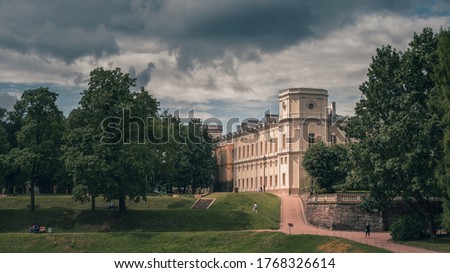 Beautiful panoramic landscape of the Park with a pond and a Great Gatchina Palace. Russia.