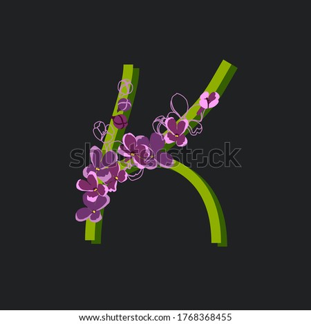 Blooming initial letter K. Decorative floral font on a dark background. Vintage garden plant typography. Alphabet made of lilac flowers.