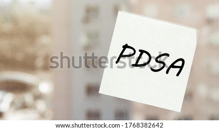 white paper with text ?PDSA on the window