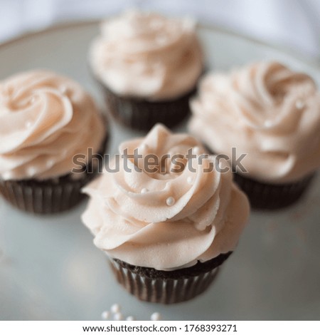 Chocolate cupcakes with pink icing 
