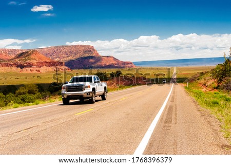 Amazing view of endless road, USA, on highway 66. Classic panorama view of historic U.S. Route 66 in beautiful light before sunset Royalty-Free Stock Photo #1768396379