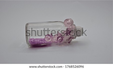 A picture of a pink lollipop for newborns with beautiful shapes presented as gifts for the baby's birthday