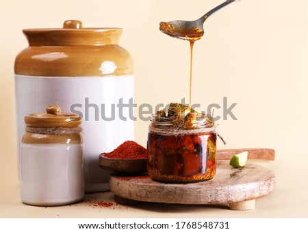 Homemade Mango Pickle or aam ka achar or Kairi Loncha in a white jar, selective focus

 Royalty-Free Stock Photo #1768548731