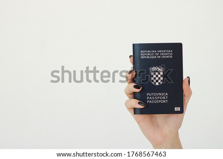 Croatian passport in girl's hand