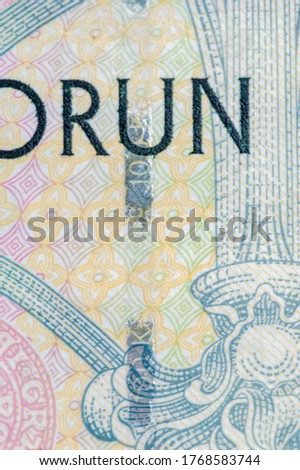 Plastic security strip on 100 CZK banknote. Security strip on Czech koruna banknote created to prevent counterfeiters.