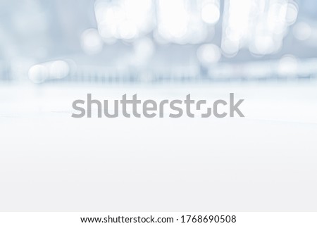 EMPTY ICE HOCKEY STADIUM BACKGROUND, BLURRED WHITE INTERIOR WITH ICY FLOOR AND BOKEH LIGHTS, COLD WINTER DESIGN, CHRISTMAS BACKDROP