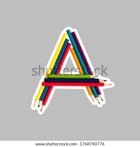 Childish alphabet - letter A, alphabet made from colorful pencils.