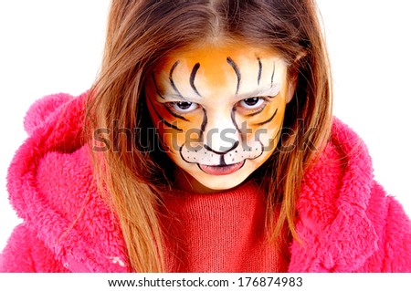 little girl painted as a tiger isolated in white
