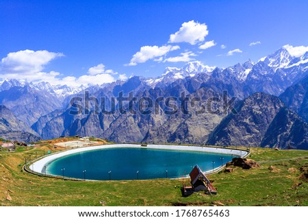 Artificial lake in Auli Uttarakhand with Garhwal mountain range in the background Royalty-Free Stock Photo #1768765463