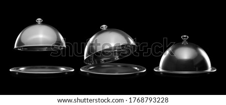 Trays with cloches on dark background Royalty-Free Stock Photo #1768793228