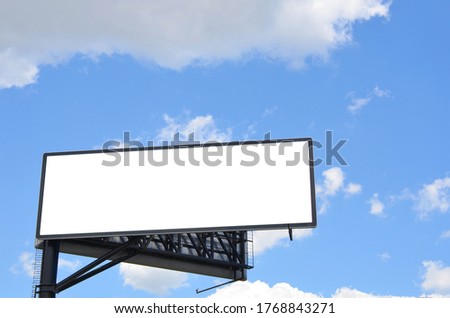 Blank billboard against large blue sky