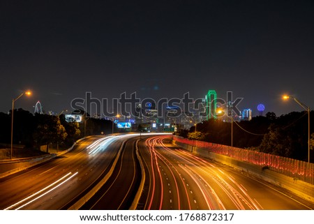 Long Exposure View of Downtown Dallas With Wide Highway and Traffic Lights