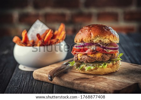 american hamburger with glass of beer in american restaurant or pub, product photography for restaurant in american style