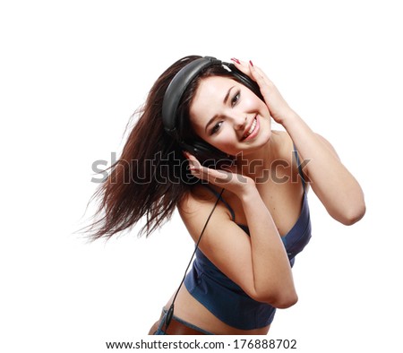 Young woman with headphones listening music happy dancing