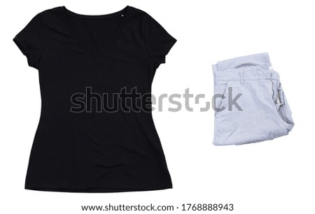 Summer black t-shirt and folded pants isolated mock up, empty black t shirt close up