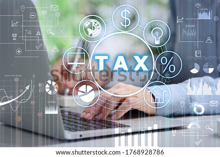 Tax concept. Scheme with icons, charts and man using laptop on background