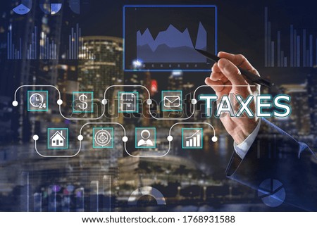 Tax concept. Man using virtual screen, closeup