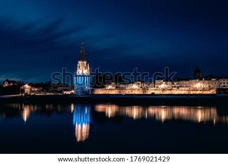 Panoramic view of the old harbor of La Rochelle at blue hour with its famous old towers