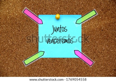 
white and multicolored notes on cork board with message
Together we will win