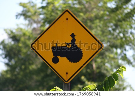 Sign warning drivers of possible tractors on the highway
