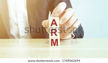 Man made word arm with wood blocks