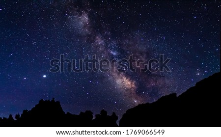 Milky Way landscape with mountain silhouette. 
