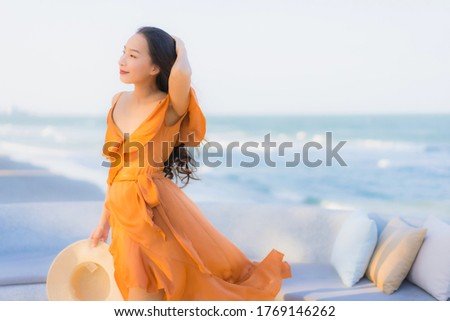 Portrait beautiful young asian woman happy smile around sea ocean beach and blue sky for leisure travel vacation
