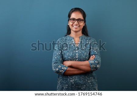 Portrait of a smiling woman of Indian ethnicity  Royalty-Free Stock Photo #1769154746