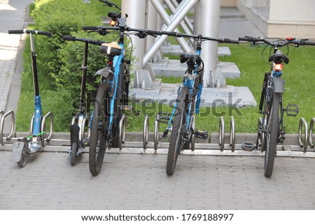 Bicycles parked in special metal Parking lots