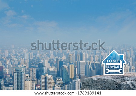 Hammer and wrench with house flat icon on rock mountain over modern city tower, office building and skyscraper, Business home service concept