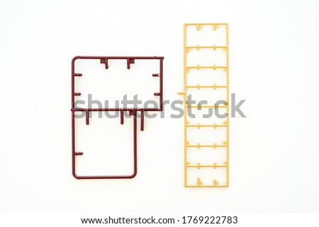 empty plastic Sprue or model kit assembly toy injection molding set after cut part on white background