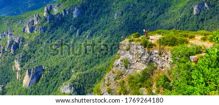 woman hiking canyon in cevennes national park- France, adventure, extreme sport concept Royalty-Free Stock Photo #1769264180