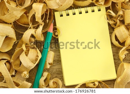 Image notepad for background and texture of wood shavings/Notebook on wooden background shavings 