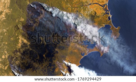 Forest fires in Australia, a view from space. Environmental problems, a large fire in the forest, a burned-out section of forest. Satellite photo, contains modified Copernicus Sentinel data