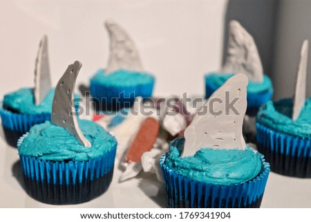 CHOCOLATE CUPCAKES WITH SHARK FINS ON TOP