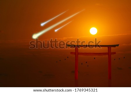 torii sunset and three meteor had fall and birds flying on the sea
