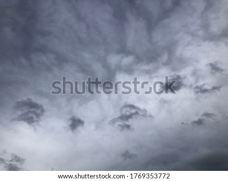 Atmosphere black overcast sky before to be rainy. Natural dramatic dark cloudy of rainy season. Cloudscape against dusk sky. Mystery with rainy sky atmosphere background. 
