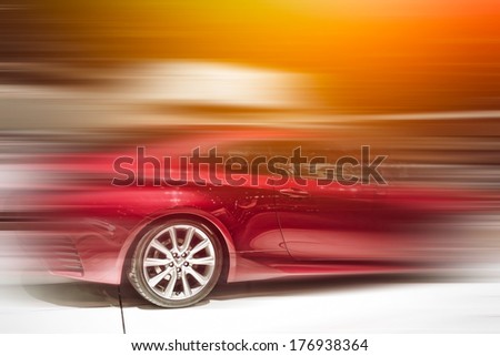 Red car in the motion Royalty-Free Stock Photo #176938364