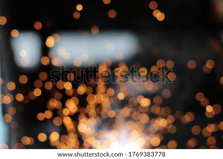 Gold abstract bokeh background, Festive xmas abstract background with bokeh defocused lights and stars
