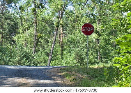 road sign STOP in forest