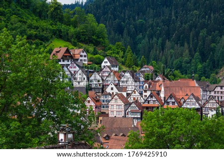 Beautiful view of the medieval village of Schiltach, Germany with its half-timbered houses surrounded by forest. Royalty-Free Stock Photo #1769425910
