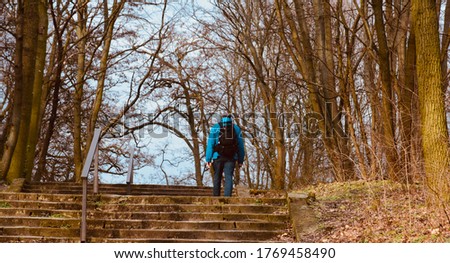 Man walking alone around a forest area in Berlin unique photo