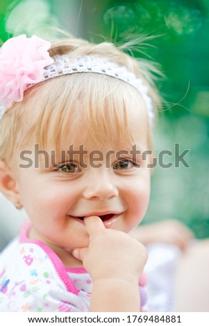 Cutest baby pic - Portrait of a beautiful little girl with a finger in her mouth