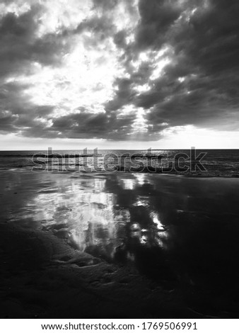Black and white picture, clouds over the sea