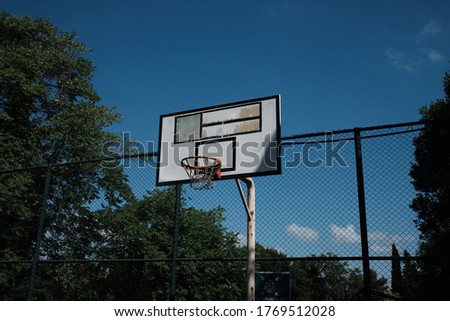 Basketball backboard in school yard on a sunny day