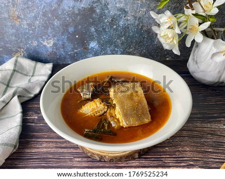 Malaysia hot, spicy and sour fish dish (stingray) called "Asam Pedas Ikan Pari" , famous dish for lunch. It is made from tamarind, chilli, other spices and add citrus leaves for the dish.