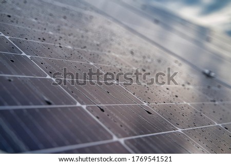 Cells of solar modules with water drops. Macro photography of solar modules.
