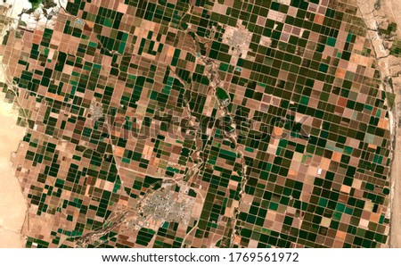 Image satellite of the presence crops and andcities. Sonora desert of Brawley, California, EUA. Observation of the surface of the earth from the sky. Generated and modified from satellite images. Royalty-Free Stock Photo #1769561972