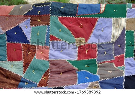 Close up of vintage crazy work wool quilt  Royalty-Free Stock Photo #1769589392